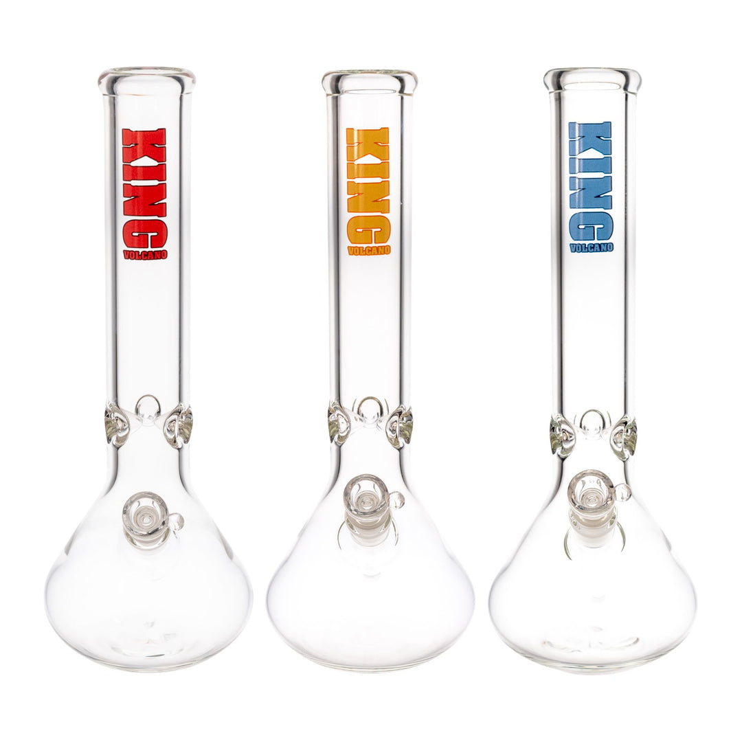 "Three glass King Volcano beakers in the colors red, yellow, and blue, against a white background," - Up N Smoke.