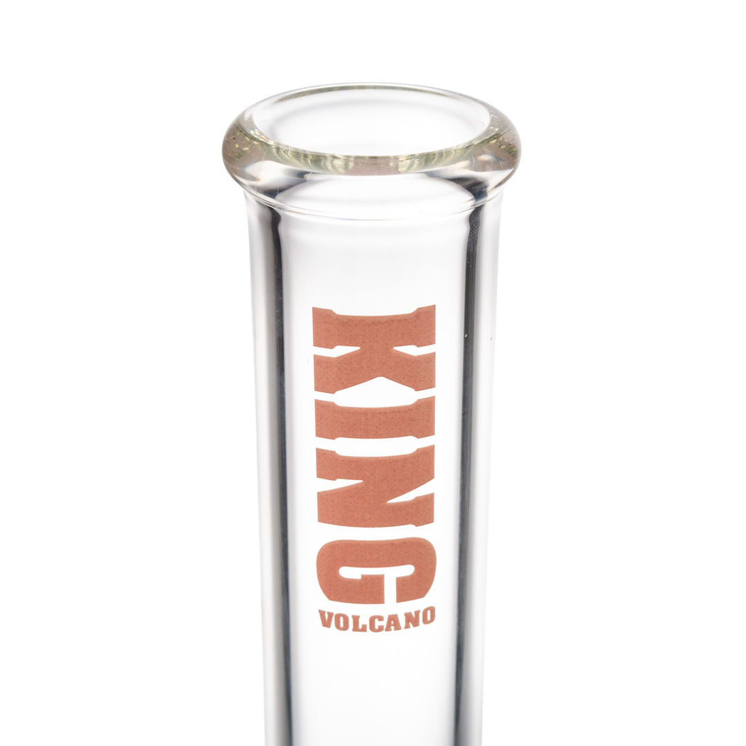 "Clear glass water pipe with pink 'King Volcano' branding near the mouthpiece against a white background," - Up N Smoke.