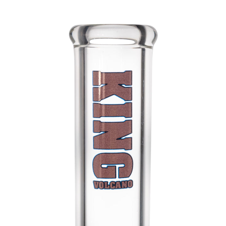 "Close-up of the purple branding on a King Volcano 50mmx14'' Beaker. This piece features a three-prong ice pinch and a diffused downstem," - Up N Smoke.