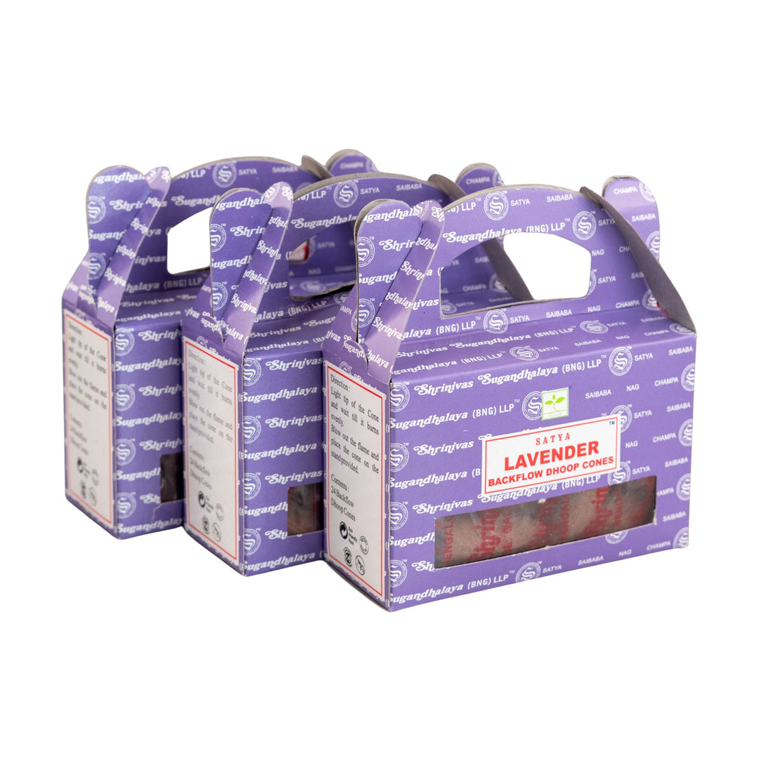 Three purple boxes with a handle, containing Satya's Lavender backflow dhoop incense cones on a white background.