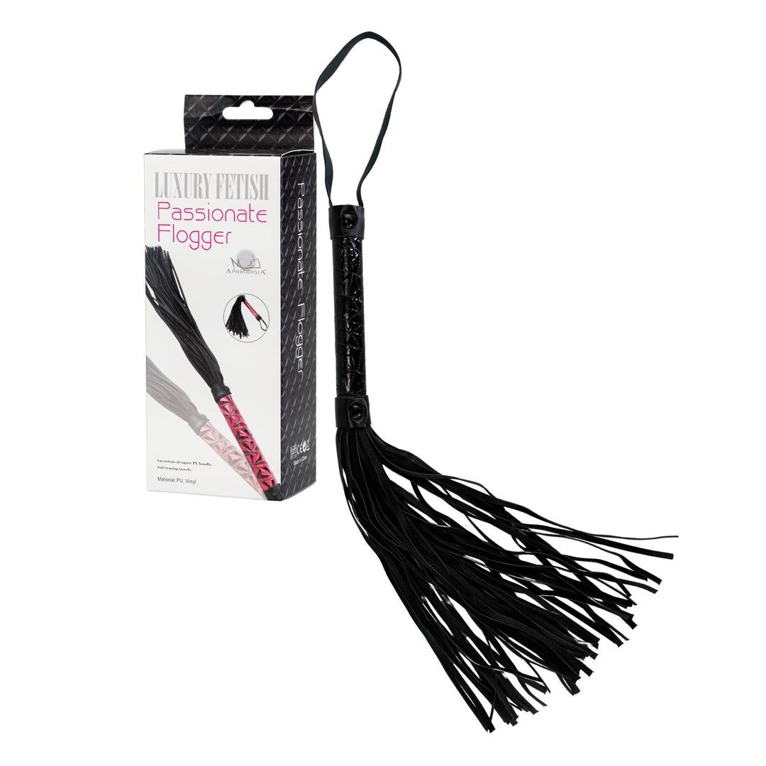 Leather Flogger Whip displayed on a white background with the product and packaging - Up N Smoke