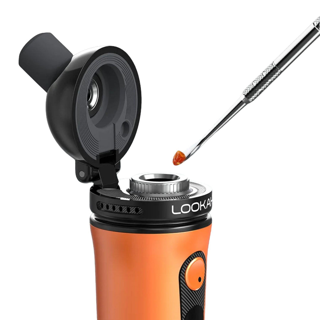 "A dab tool with concentrate on the tip being loaded into an orange Lookah Ant Concentrate Vaporizer," - Up N Smoke.