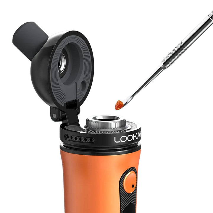 "A dab tool with concentrate on the tip being loaded into an orange Lookah Ant Concentrate Vaporizer," - Up N Smoke.