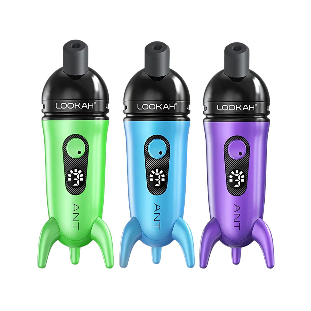 "Group of three Lookah Ant Concentrate Vaporizers in the colors green, blue, and purple on a white background," - Up N Smoke.