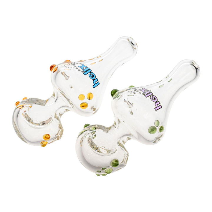 "Two Mini American Helix hand pipes adorned with colored glass beads on a white background," - Up N Smoke.