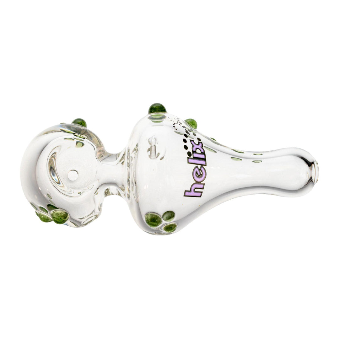 "Top-down view of a 4'' Mini American Helix hand pipe that has a purple logo decal and is adorned with green glass dots," - Up N Smoke.