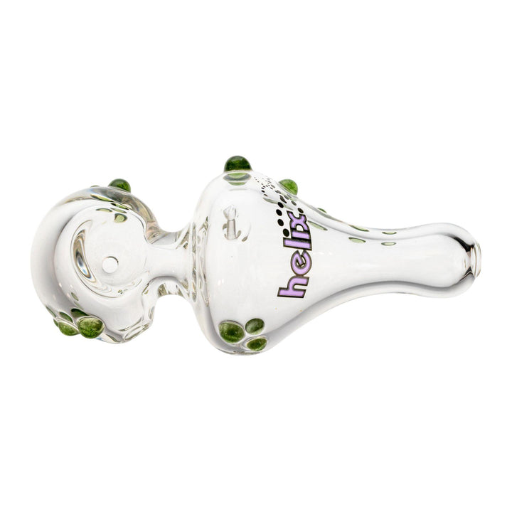 "Top-down view of a 4'' Mini American Helix hand pipe that has a purple logo decal and is adorned with green glass dots," - Up N Smoke.