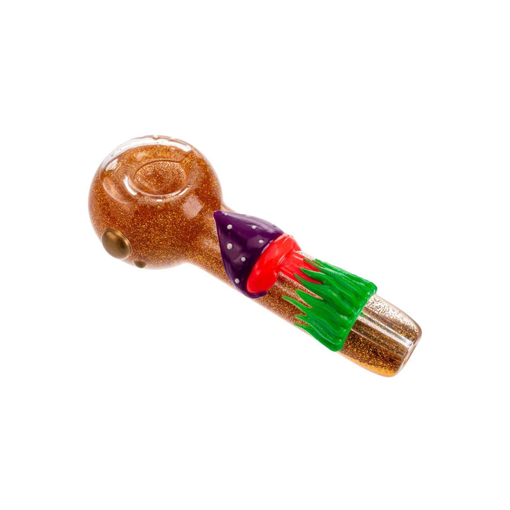 "5-inch gold glitter glycerin hand pipe with a UV and black light-reactive mushroom on the handle, designed for freezing to provide smoother hits, with a front carb for easy control." - Up N Smoke.