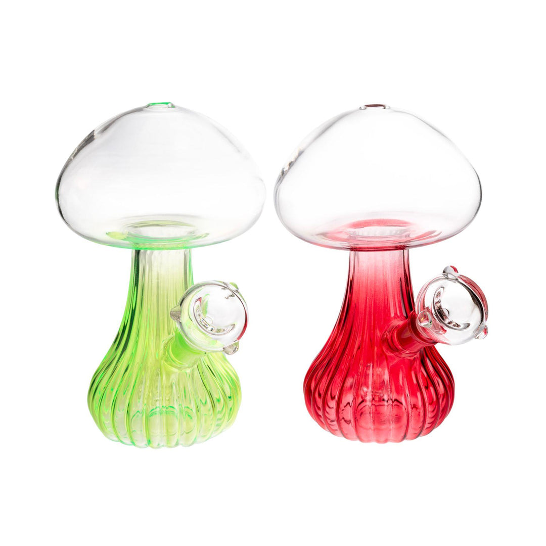 "Clear glass mushroom water pipe, 7 inches tall, featuring a pluming mushroom design with a neon base, fixed diffuser downstem, and 14mm male herb slide. Colors vary." - Up N Smoke.