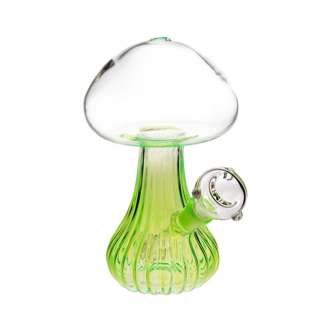 Clear glass mushroom water pipe, 7 inches tall, featuring a pluming mushroom design with a green neon base, fixed diffuser downstem, and 14mm male herb slide." - Up N Smoke.