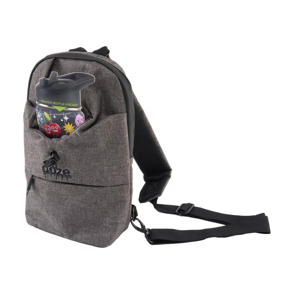 "Gray Ooze backpack with a water bottle holder on a white background," - Up N Smoke.