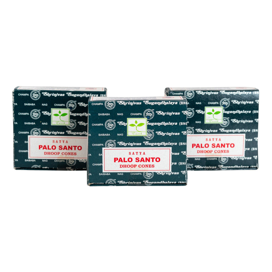 Three boxes of Satya Palo Santo Dhoop Cones on a white background