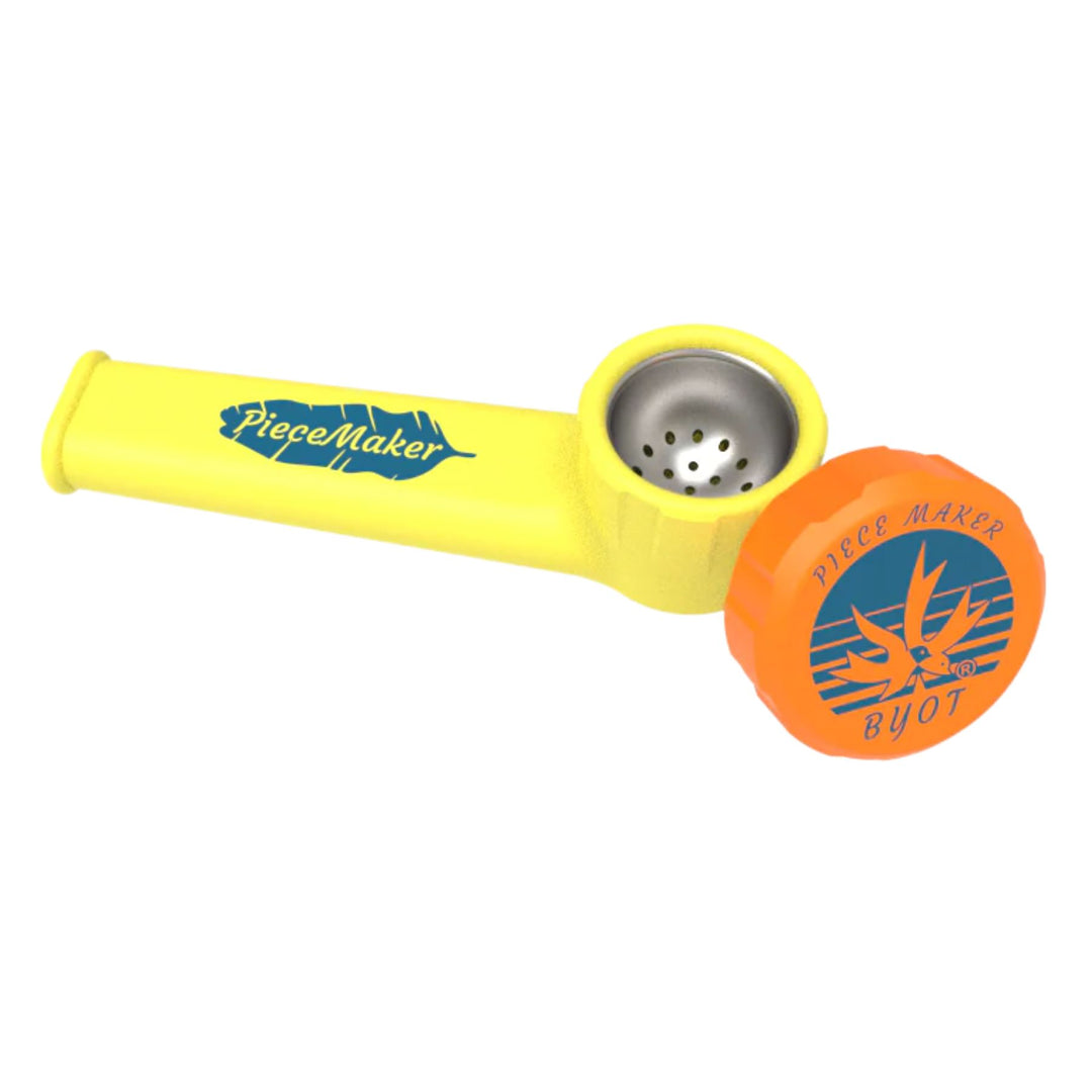 "Yellow PieceMaker Karma Silicone Pipe with orange accents against a white background," - Up N Smoke.