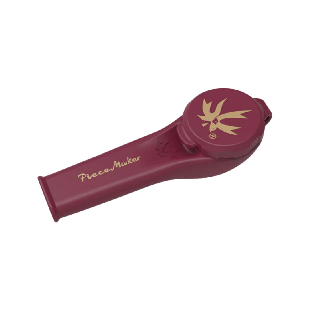 "A red and gold Piecemaker Karma Kayo Silicone Pipe that features a tethered cap and a borosilicate glass bowl," - Up N Smoke.