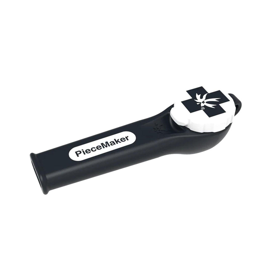 "A black and white Kiwi Piecemaker Silicone Pipe that features a tethered bowl cap and a borosilicate glass bowl," - Up N Smoke.