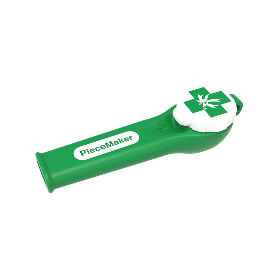 "A green and white Piecemaker that is made out of silicone and features a tethered bowl cap," - Up N Smoke.