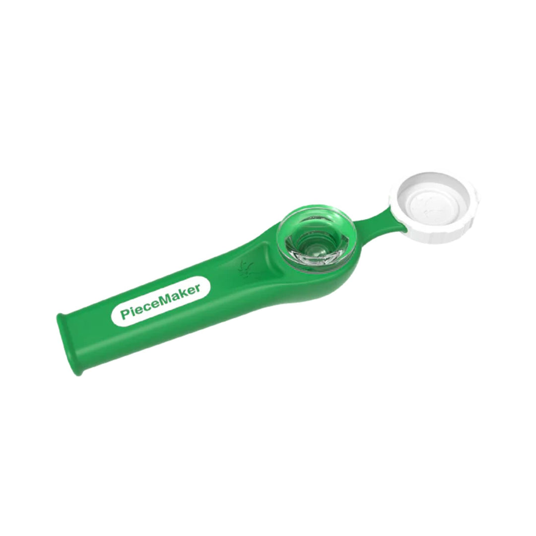 "An open green Kiwi Piecemaker Silicone Pipe showcasing its tethered bowl cap and removeable borosilicate glass bowl," - Up N Smoke.
