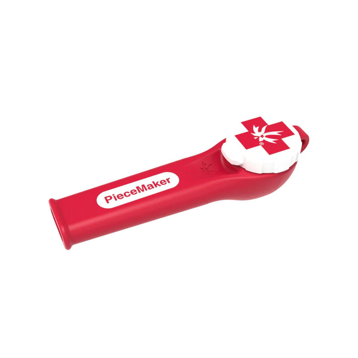 "A red and white Kiwi Piecemaker Silicone Pipe that has a tethered bowl cap," - Up N Smoke.