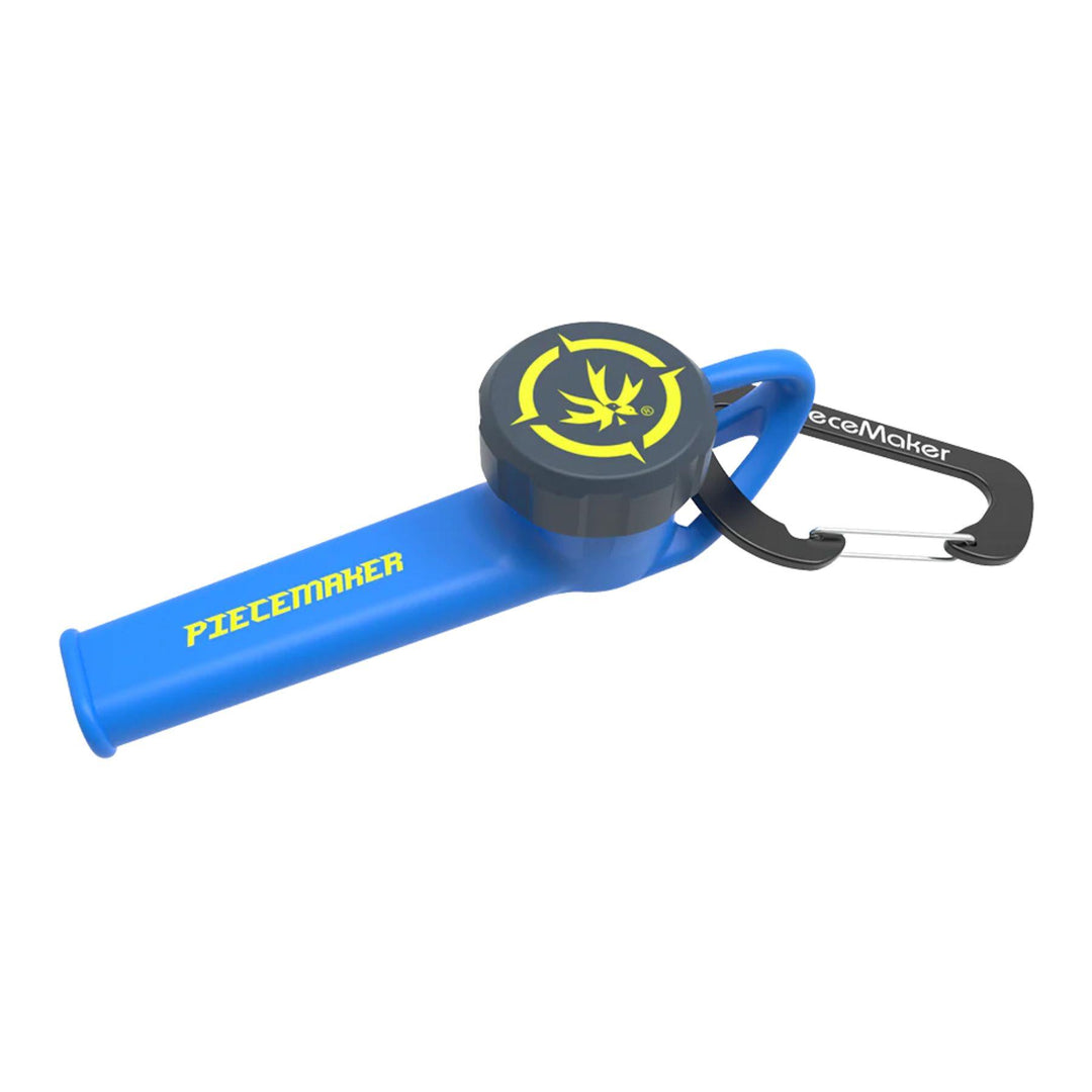 "A blue Piecemaker 'Karma Go!' Silicone Travel Pipe that features a cap for the bowl and a carabiner," - Up N Smoke.