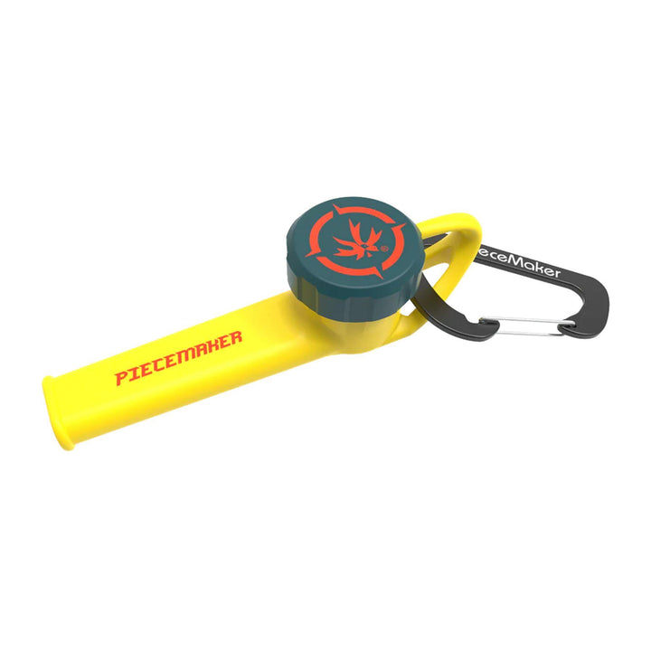 "A yellow silicone travel pipe made by Piecemaker that comes with a carabiner and a bowl cover," - Up N Smoke.