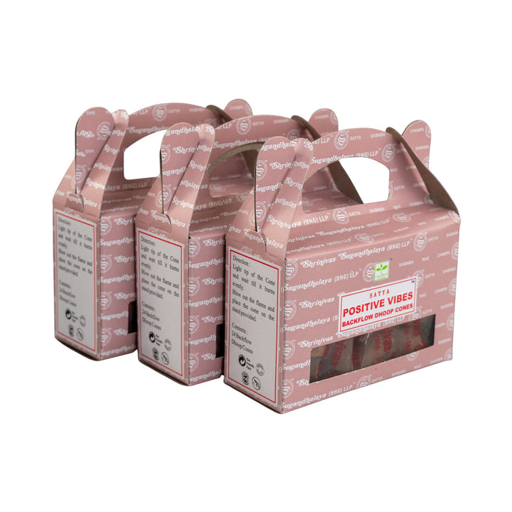 Set of three Satya's Positive Vibes Backflow Incense Cones on white background