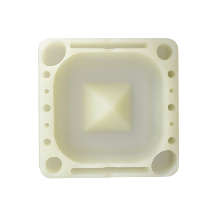 "A square silicone Pulsar Tap Tray in the color glow in the dark on a white background," - Up N Smoke.