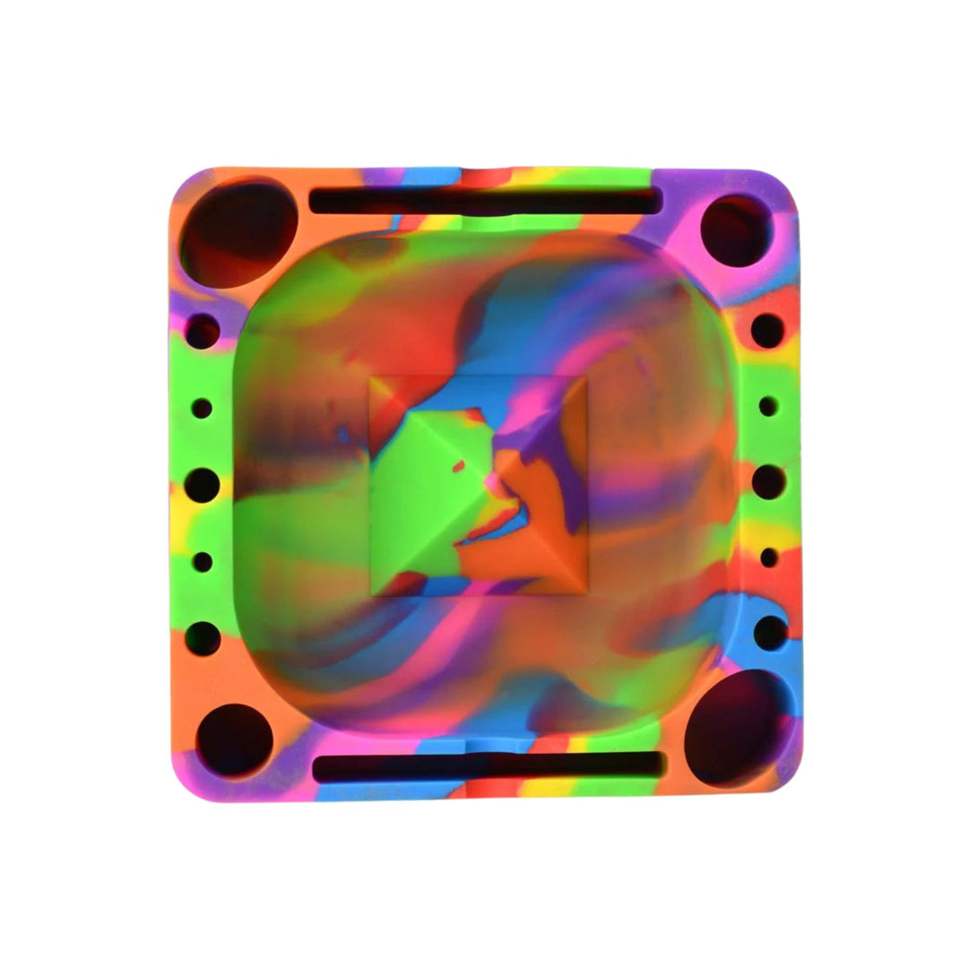 "A colorful Pulsar Tap Tray in the variation Tie Dye on a white background," - Up N Smoke.