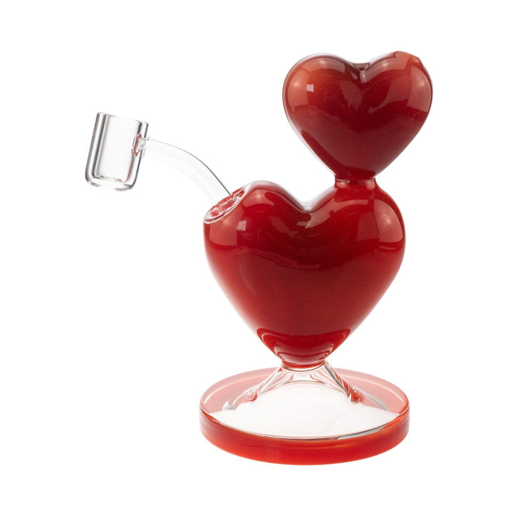 "Backside of a Pulsar Double Heart Dab Rig on a white background," - Up N Smoke.