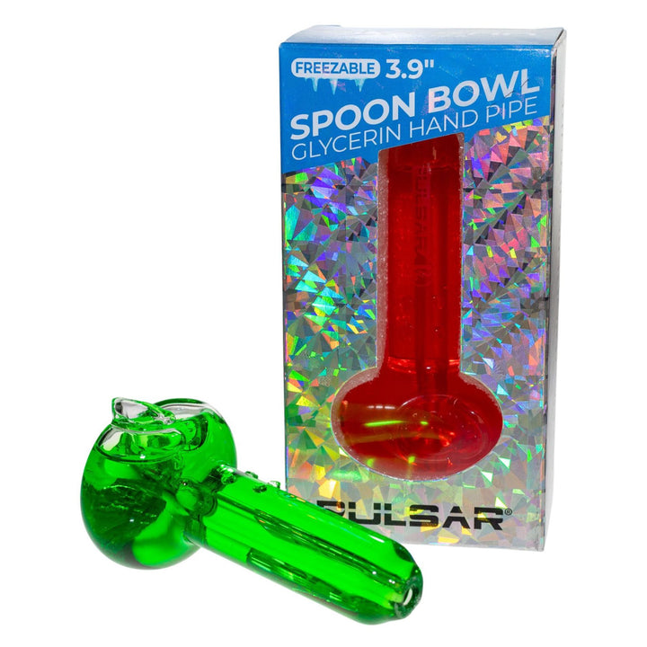"Green glass glycerin spoon in front of packaging displaying a red herb spoon on a white background," - Up N Smoke.