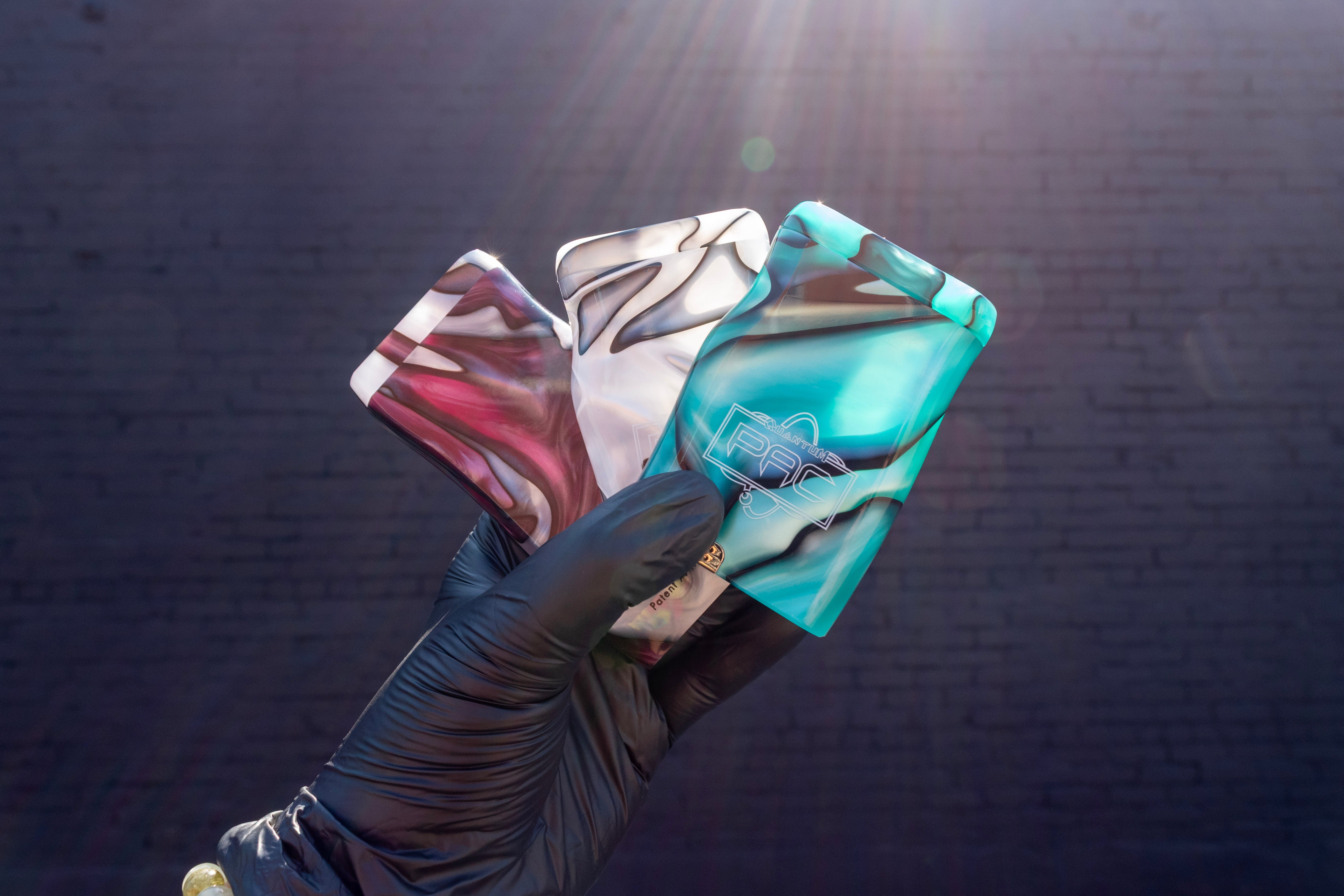 Quantum Resin Pac Dugouts fanned out in a hand - Up N Smoke