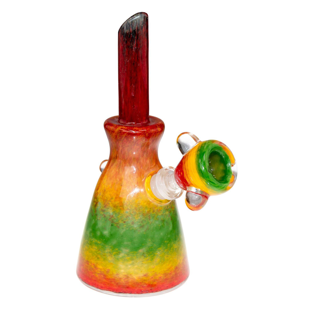 "Side angle of a Rasta Water Pipe that stands at 6 inches tall and features a matching herb slide," - Up N Smoke.