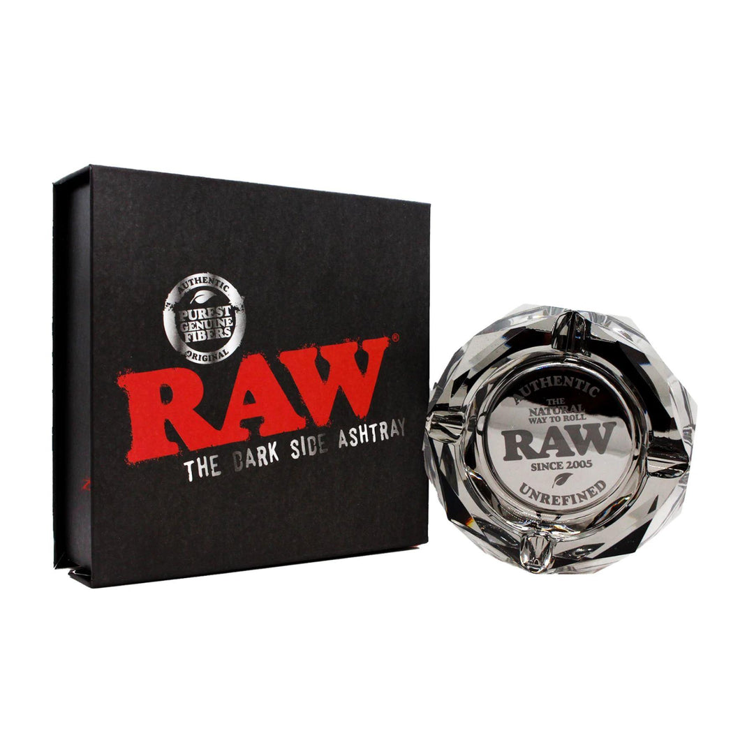 "Raw Dark Side Ashtray next to its box on a white background,' - Up N Smoke.
