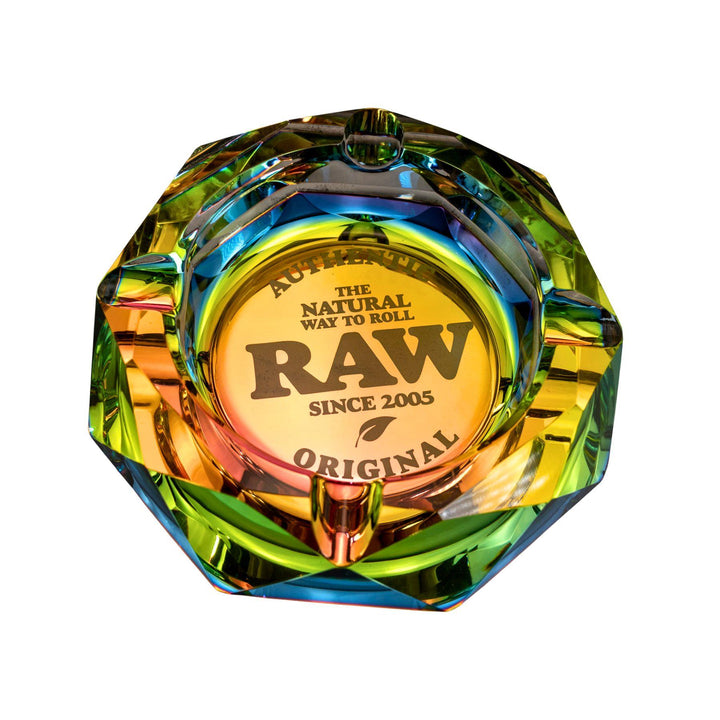 "Top-down view of a Raw Rainbow Ashtray that has the brand logo etched into the center," - Up N Smoke.