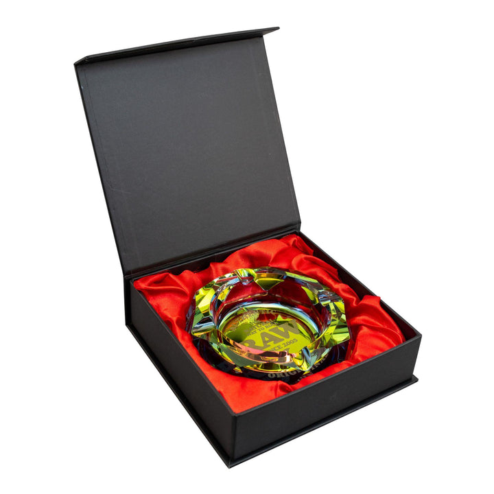 "Raw Rainbow Ashtray within a black box cradled by red fabric on a white background," - Up N Smoke.