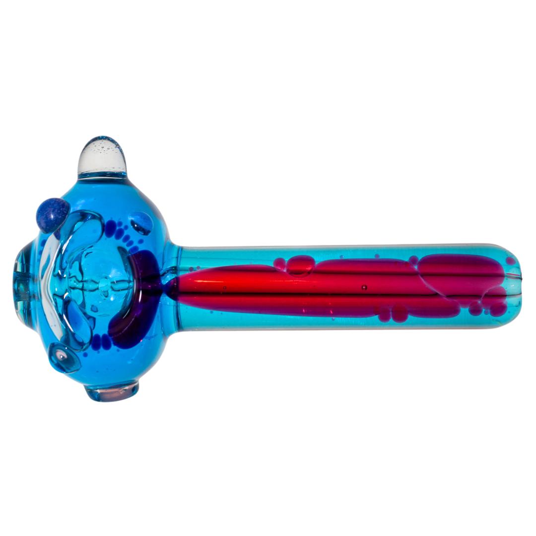 This is a top view of a Raymond Bray glycerin lava spoon. The interior has a blue and red liquids that move depending on how it is held. Glycerin pieces can be frozen for colder and smoother hits. - Up N Smoke.