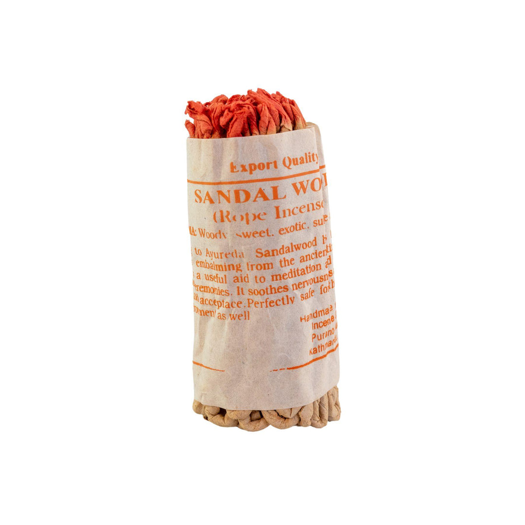 "Sandalwood incense sticks in a cloth package with text on a white background," - Up N Smoke.
