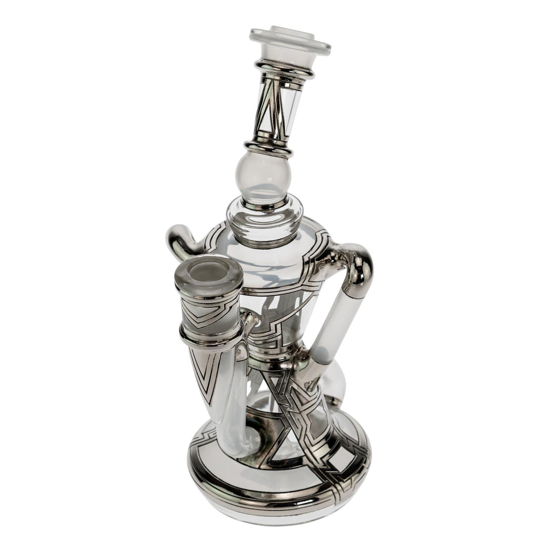 "Slight left side of a Ryan Fitt Klein Recycler that is approximately 8 inches tall and has a base diameter of 3 inches on a white background," - Up N Smoke.
