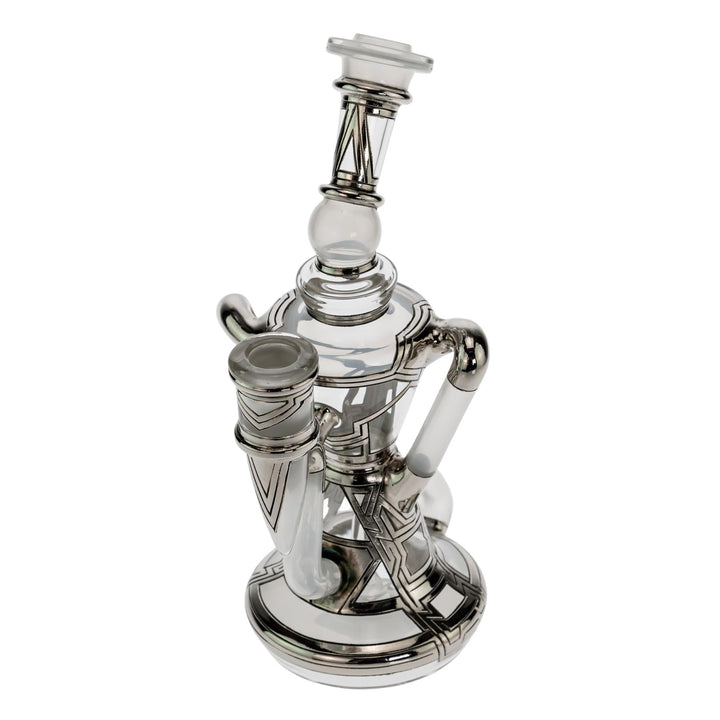 "Slight left side of a Ryan Fitt Klein Recycler that is approximately 8 inches tall and has a base diameter of 3 inches on a white background," - Up N Smoke.