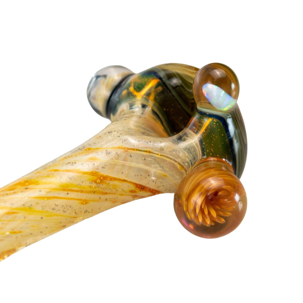 "Handcrafted herb spoon featuring a genuine opal, swirled blue and orange marbles, and glittered orange streaks." - Up N Smoke.