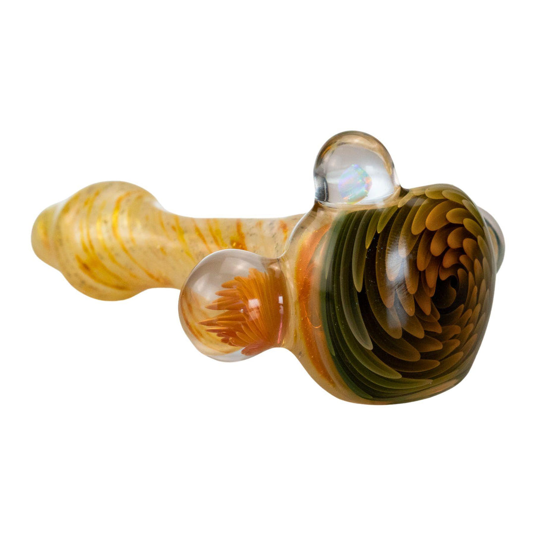 "Side view of a gold-fumed glass pipe showcasing a swirling blue-to-white marble and light orange bead." - Up N Smoke.