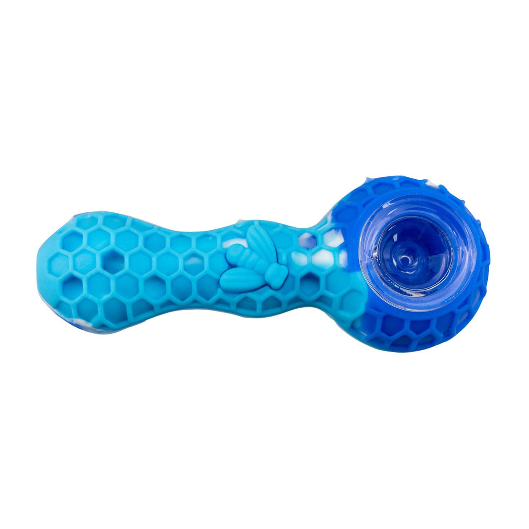 "Blue honeycomb-patterned smoking pipe on a white background," - Up N Smoke.