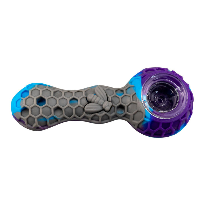 "A purple and grey honeycomb-patterned silicone pipe on a white background," - Up N Smoke.