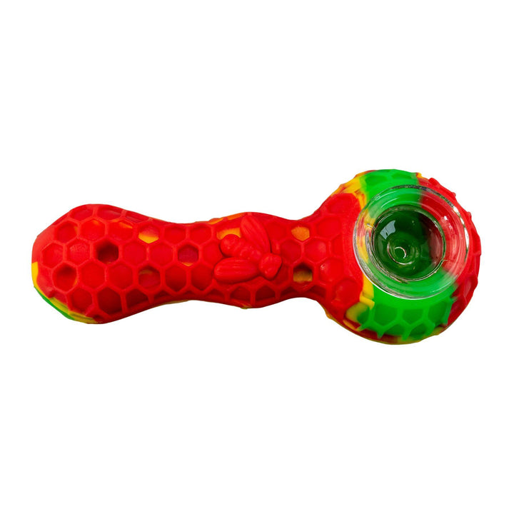 "A rasta Silicone Bee Spoon that is embossed with a honeycomb-pattern and adorned with a bee on the bodice," - Up N Smoke.