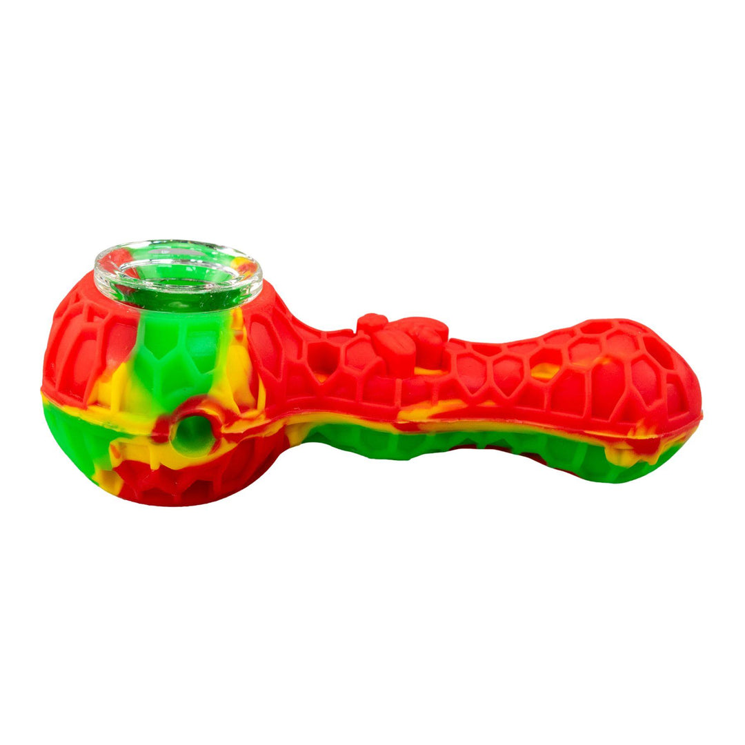 "Left-side of a rasta-colored hand pipe that is embossed with a honeycomb-pattern and is adorned with a bee on the bodice," - Up N Smoke.