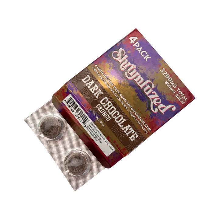 "Slightly open package of a Shrumfuzed Dark Chocolate Crunch 4pk on a white background," - Up N Smoke.