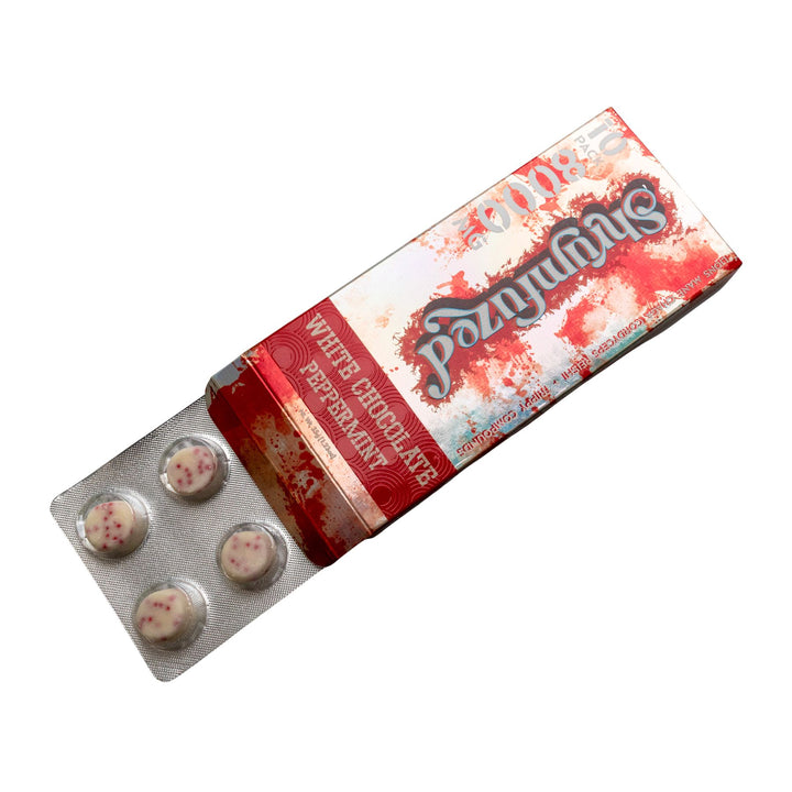 "Slightly open package of a Shrumfuzed Mushroom White Chocolate Peppermint 10pk on a white background," - Up N Smoke.