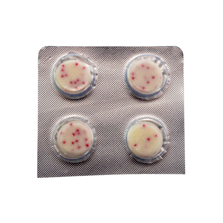 "Four round Shrumfuzed White Chocolate Peppermint morsels in a blister pack on a white background," - Up N Smoke.