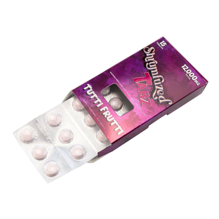 "Open box of Shrumfuzed Mushroom Tablets in the flavor variation Tutti Frutti on a white background," - Up N Smoke.