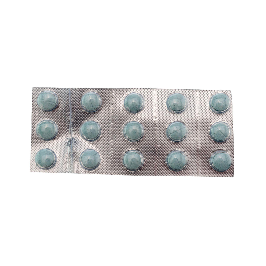 "Top-down view of a 15 pills in a blister pack of blue Shrumfuzed Mushroom Tablets in the flavor variation Blue Slushee on a white background," - Up N Smoke.