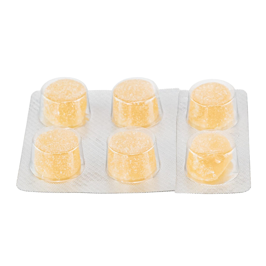 Shrumfuzed Max 9600MG Mushroom Gummies Mango gummies on a white background - Up N Smoke